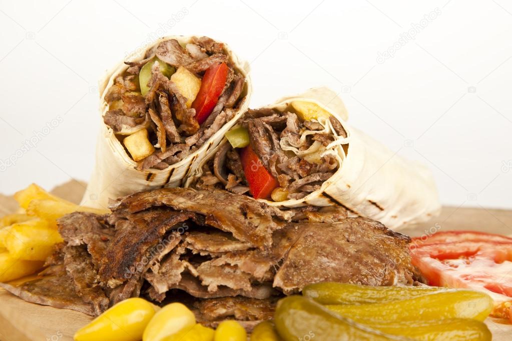 Doner Kebab - grilled meat, bread and vegetables shawarma sandwich