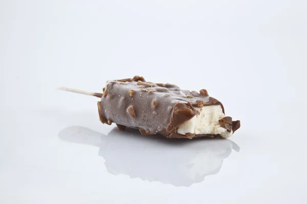 Ice cream covered with chocolate and almonds. — Stock Photo, Image