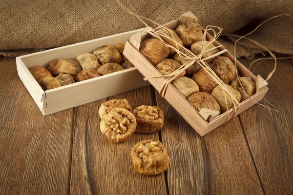 Dried figs with walnuts concept with wooden table — Stock Photo, Image