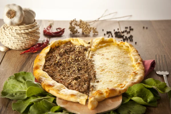 Delicious heart shaped meat and cheese Turkish pizza pide — Stock Photo, Image