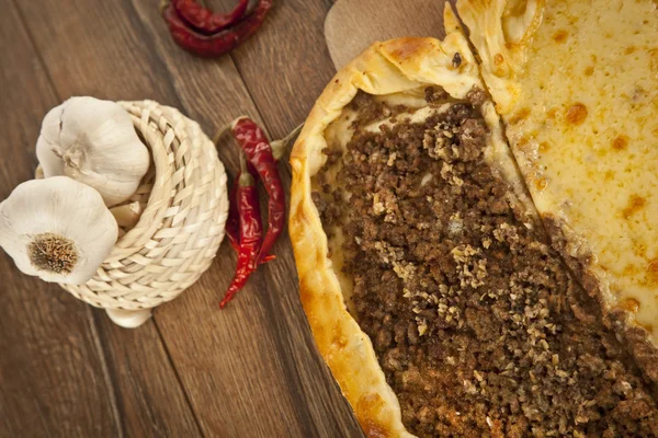 Delicious heart shaped meat and cheese Turkish pizza pide — Stock Photo, Image