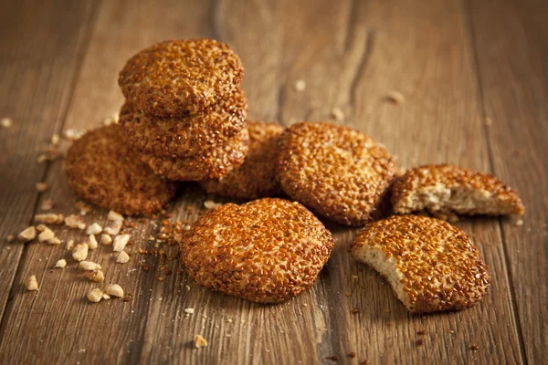 Homemade cookies with sesame seeds, on wooden table — Stock Photo, Image