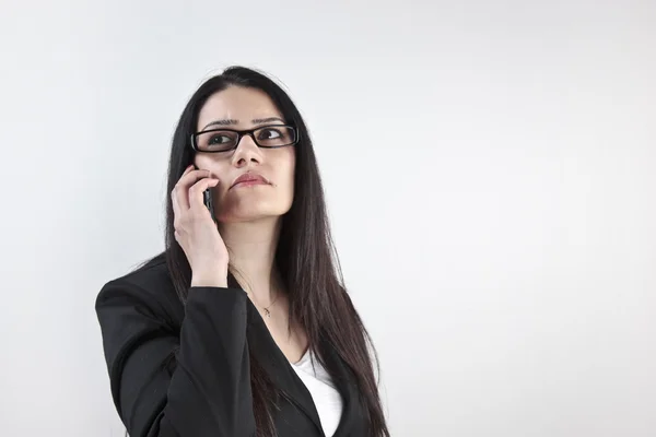 Businesswoman calling on the phone with white background — Stock Photo, Image