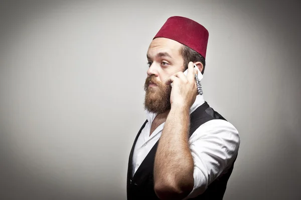 Man in traditional turkish hat and dress kabadayi talking phone — Stock Photo, Image