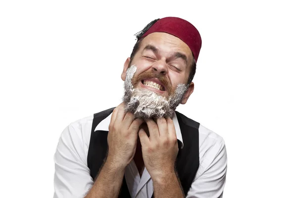 Man in traditional turkish hat and dress kabadayi unhappy shaving — Stock Photo, Image