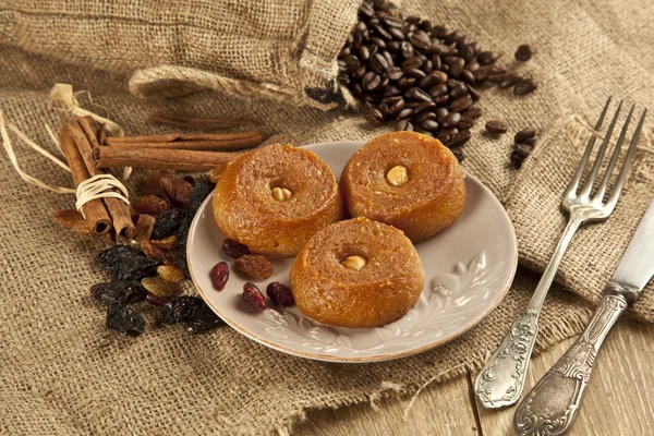 Turkish Ramadan sweet - Sekerpare with wooden background — Stock Photo, Image