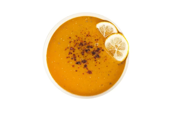 Krémová čočková polévka s plátky citronu s bílým pozadím — Stock fotografie