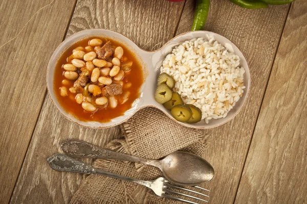 Hot turkish bean stew with a tasty tomato sauce and rice turkish pilav — Stock Image Hot turkish bean stew with a tasty tomato sauce and rice turkish pilav Stock Image
