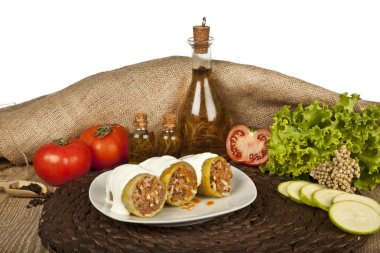 Stuffed zucchini, kabak dolmasi, Turkish and greek cuisine with concept background clipart