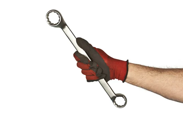 Wheel wrench in hand with gloves isolated on white — Stock Photo, Image