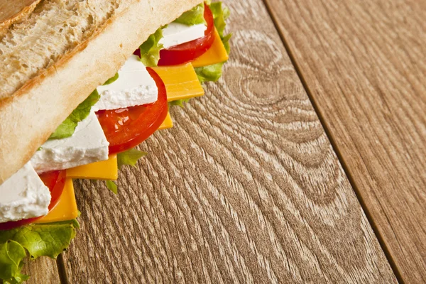 Different kind of cheese sandwich and tomatoes with concept background — Stock Photo, Image