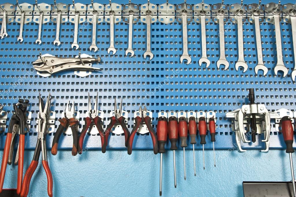 Different Car repair tools set on the wall Stock Photo by ©gorkemdemir  69357071