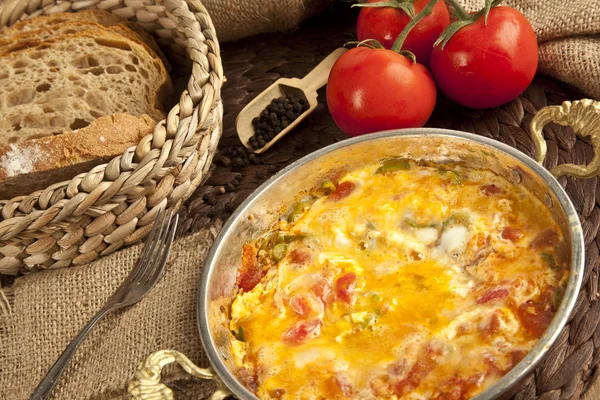 Menemen Turkish breakfast food egg, tomatoes and pepper in pan — Stock Photo, Image