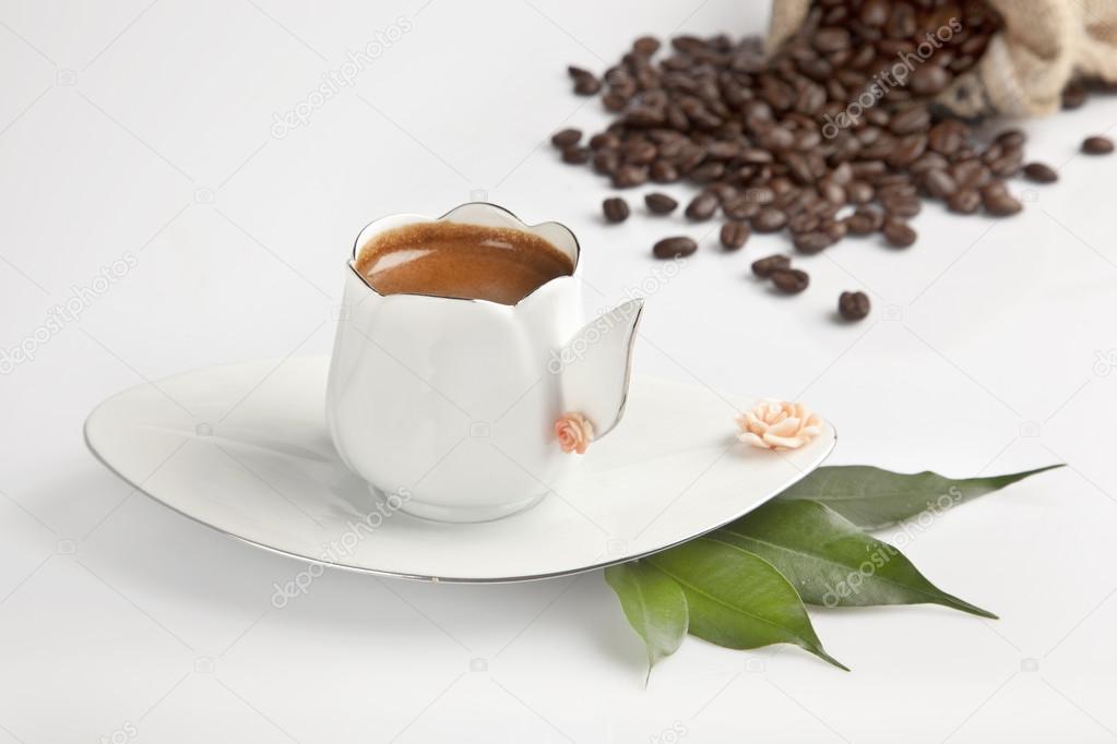 Traditional Turkish Coffee cup and beans concept tulip cup