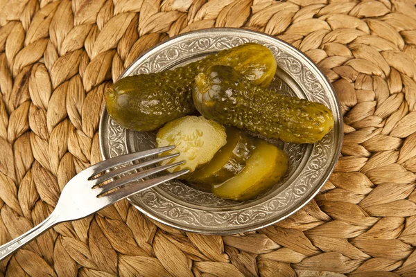 Pickled Cucumbers with wooden background — Stock Photo, Image