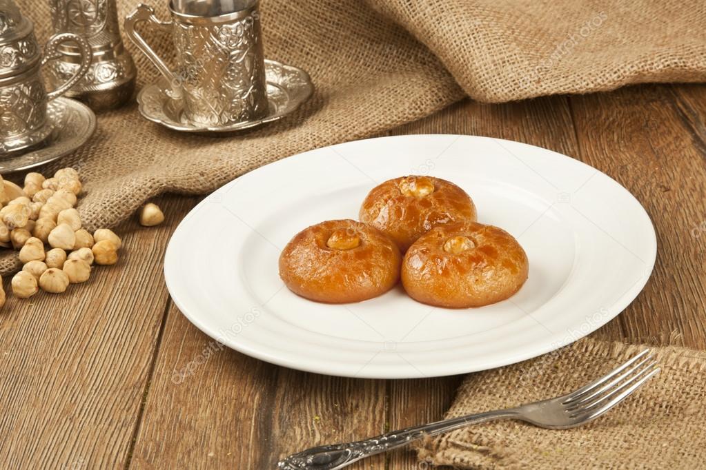 Turkish Ramadan sweet - Sekerpare with wooden background