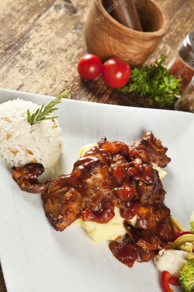 Chicken in tomato sauce with a boiled vegetables, turkish pilav ( pilaf