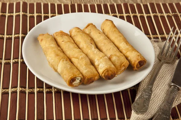 Turkish cheese fried dough borek patty with wooden background — Stock Photo, Image