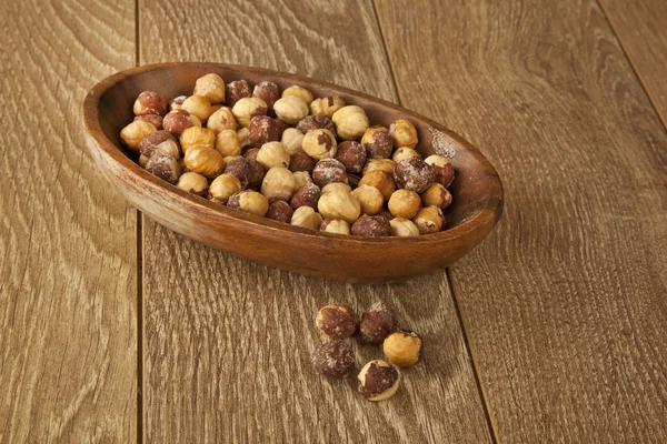 Mix nuts on a wooden table — Stock Photo, Image