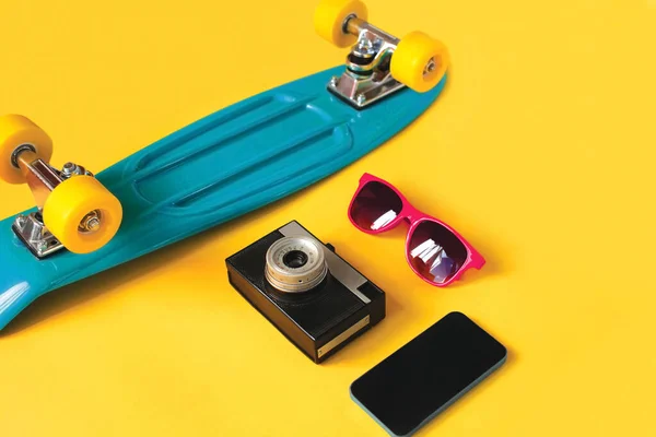 Vivid Blue Skateboard Sunglasses Vintage Film Camera Frameless Phone Screen — 스톡 사진