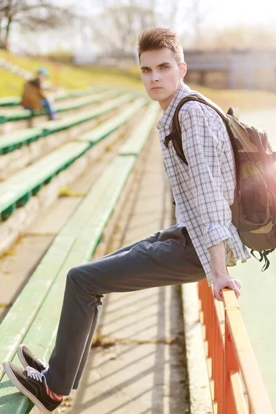 Outdoor lifestyle portrait of handsome guy with backpack summer — Stock Photo, Image