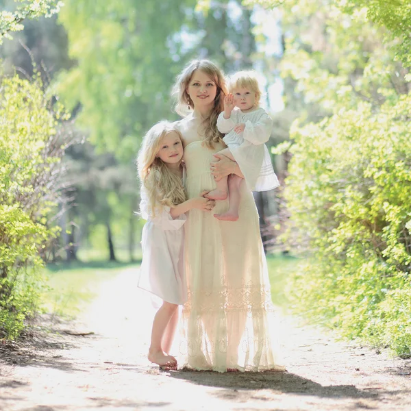 Happy mother with her daughters — Stock Photo, Image