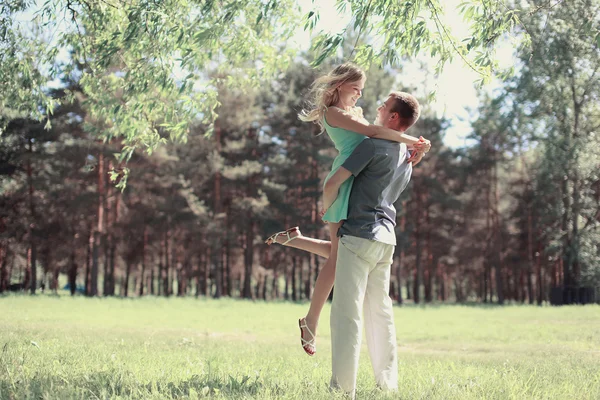 Tender photo lovely young happy couple in love, walking in sprin — Stock Photo, Image