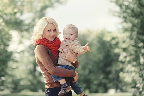 Autumn portrait happy family mother and son having fun outdoors — Stock Photo, Image