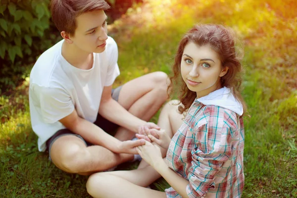 Portrait couple teenagers in the summer park — Stock Photo, Image