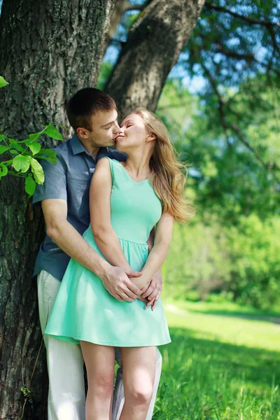 Lovely sensual couple in love enjoying kiss outdoors in warm sum — Stock Photo, Image