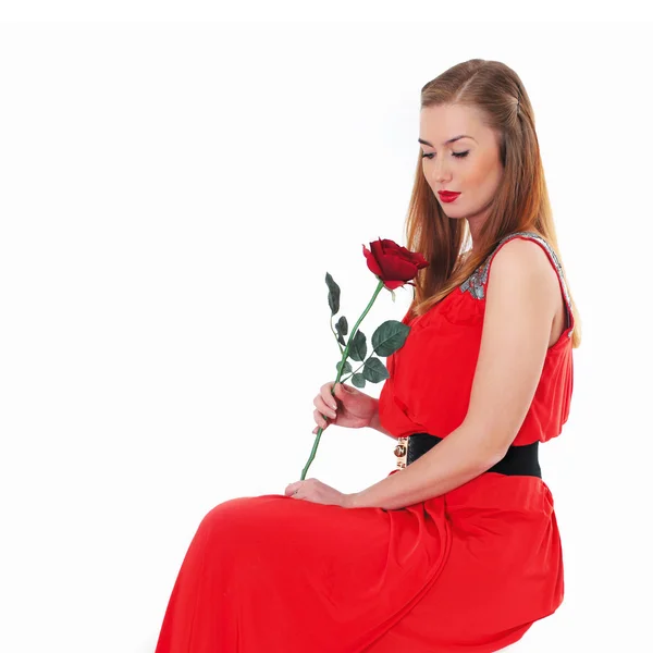 Elegant beautiful girl in a red dress with a rose — Stock Photo, Image