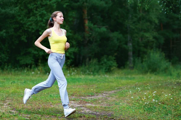 Fitness, workout, sport, lifestyle concept - woman running on th — Stock Photo, Image