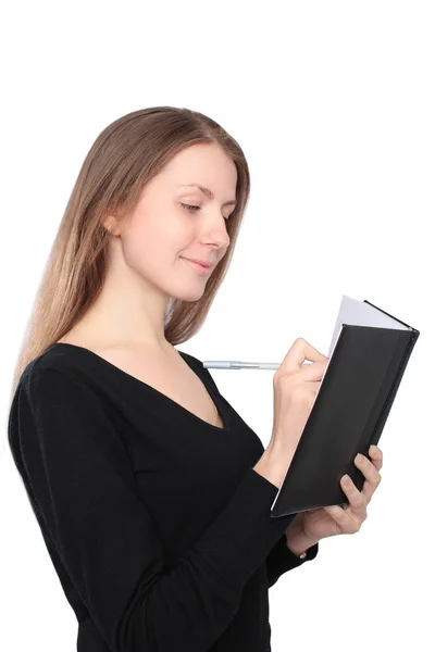 Mulher feliz escrevendo em um caderno — Fotografia de Stock