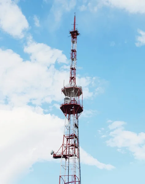 Tall telecommunication towers with antennas on blue sky — Stock Photo, Image