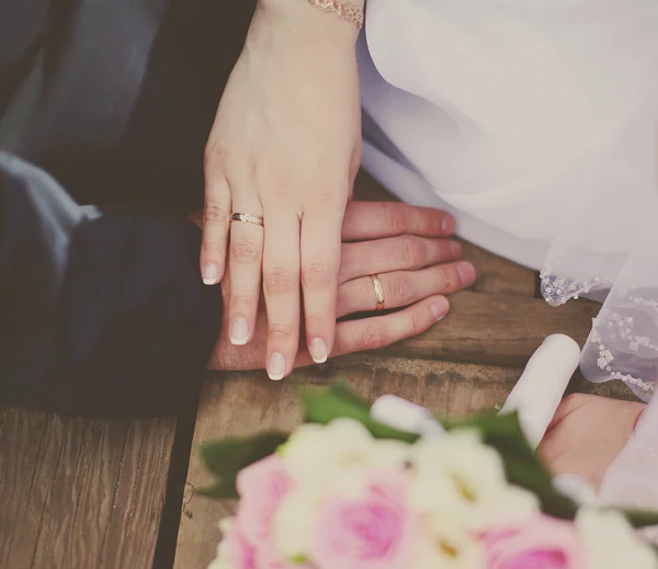 Vintage photo bride and groom holding hands in summer day — Stock Photo, Image