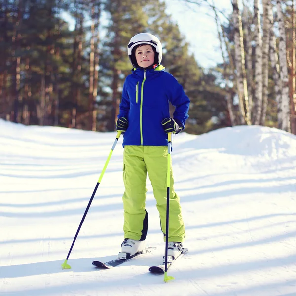 Portrait of professional skier boy dressed in sportswear and hel — Stock Photo, Image