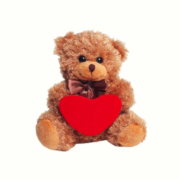 Cute teddy bear with red heart on a white background — Stock Photo, Image