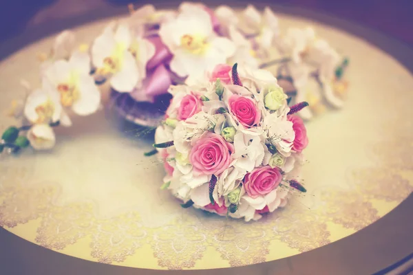 Beautiful pink wedding bouquet on the table, floral decorations