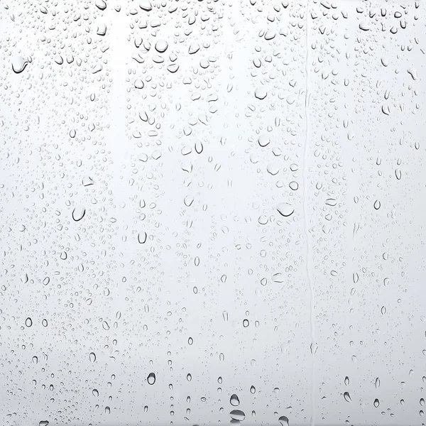 Texture drops of water on the transparent glass — Stock Photo, Image