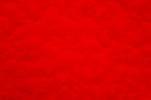 Fundo estruturado vermelho com vinheta, escurecimento nas bordas da foto. — Fotografia de Stock