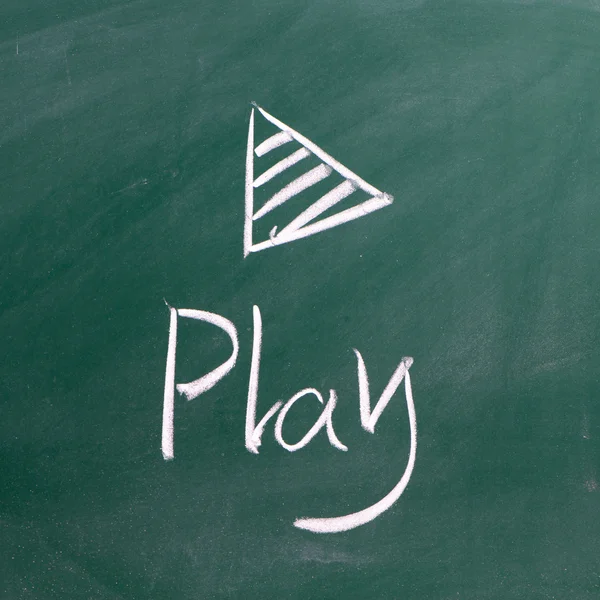 Play sign drawn with chalk on blackboard — Stock Photo, Image