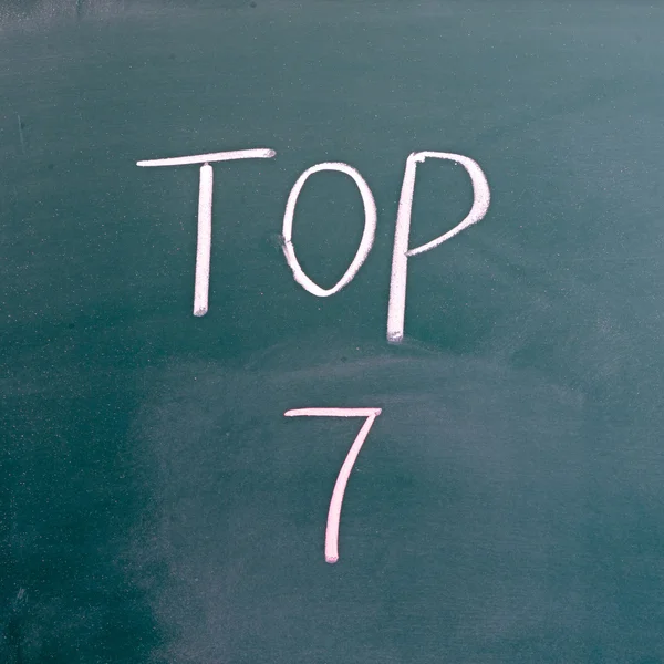 Ordet top 7 på blackboard — Stockfoto