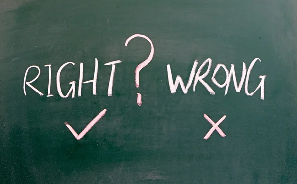 Choose right or wrong? written on blackboard — Stock Photo, Image