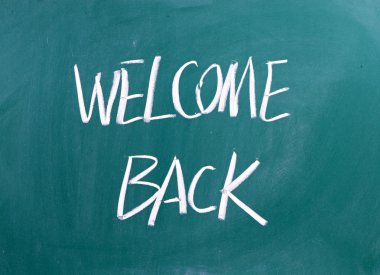 Welcome Back written on a blackboard clipart