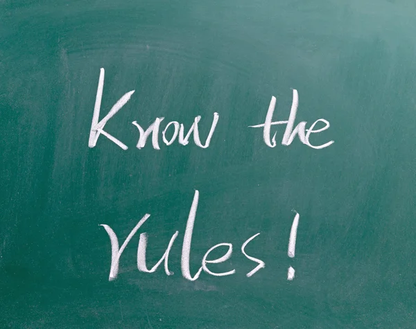 Know the rules sign on blackboard — Stock Photo, Image