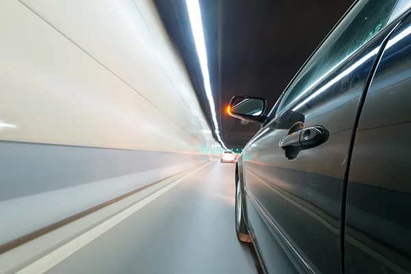 Car moving fast in tunnel — Stock Photo, Image