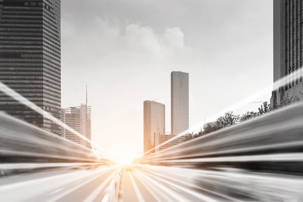 Light trails on buildings background — Stock Photo, Image