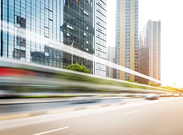 Light trails on buildings background — Stock Photo, Image