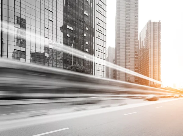 Light trails on buildings background — Stock Photo, Image