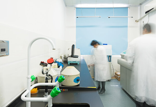 Researchers working in chemistry laboratory